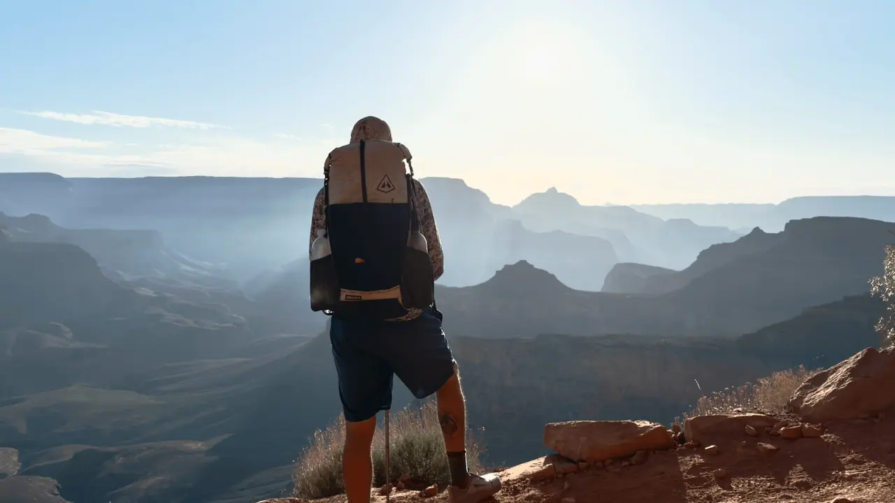 Hiker overlooking the Grand Canyon on the Arizona Trail